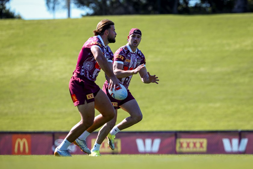 Trent Loiero readies to receive a pass from Pat Carrigan at Maroons Game One training.