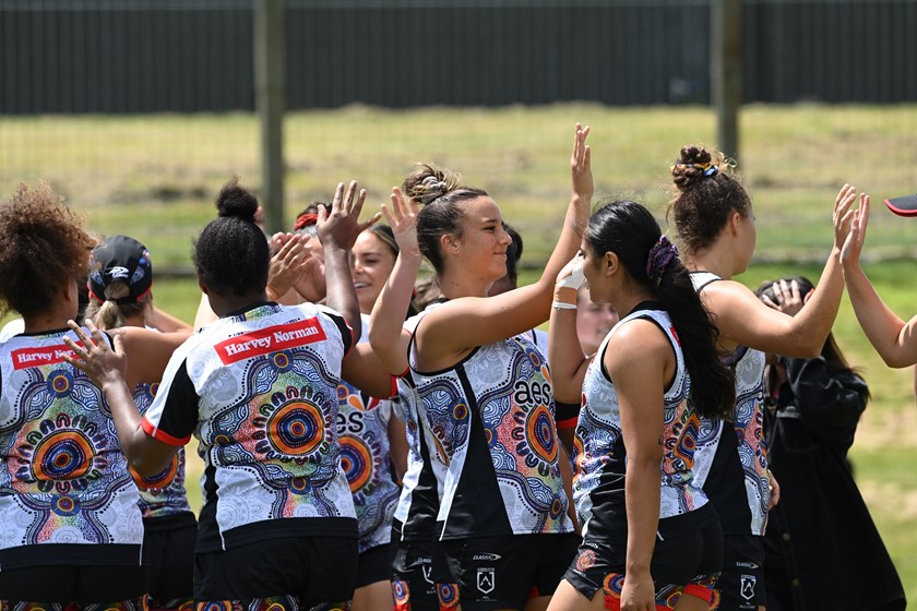 High fives at Women's Indigenous All Stars training. 