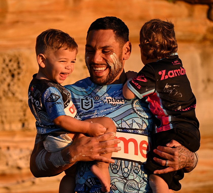 Sharks centre Jesse Ramien with his sons at Bare Island on Tuesday.