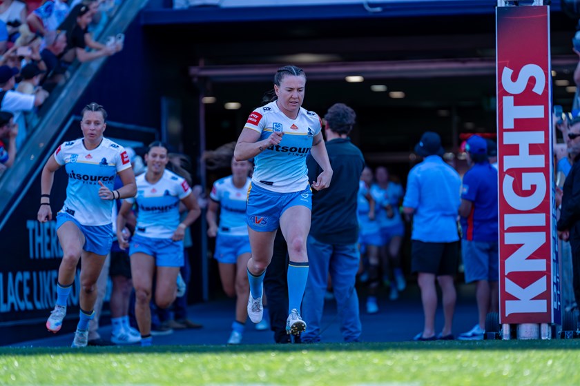 Georgia Hale leads the Titans out in their Round 10 game against the Knights.