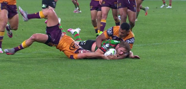 Burgess overpowers the Broncos defence close to the line