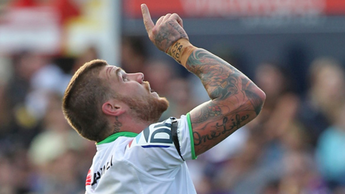 Josh Dugan points to the sky after scoring for the Raiders in their trial game against the Storm in February.