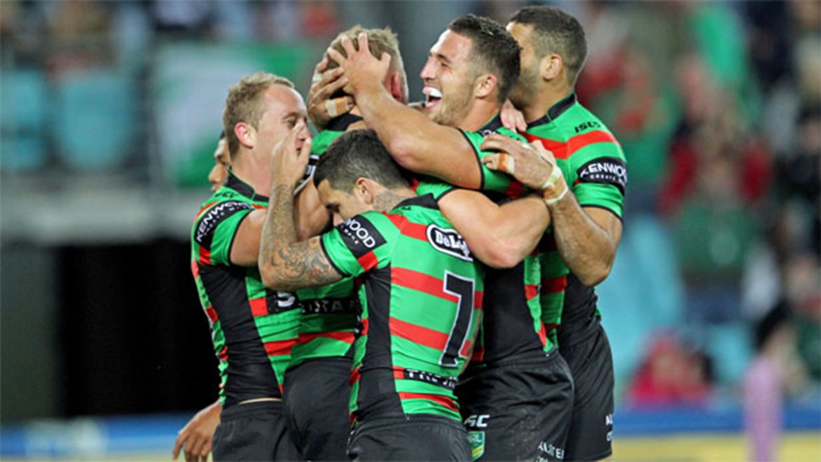 The Rabbitohs celebrate a George Burgess try in their 54-10 thrashing of Wests Tigers in round 10