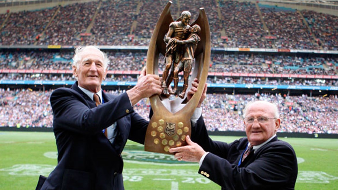 St George great Norm Provan and Western Suburbs legend Arthur Summons with the NRL premiership trophy.