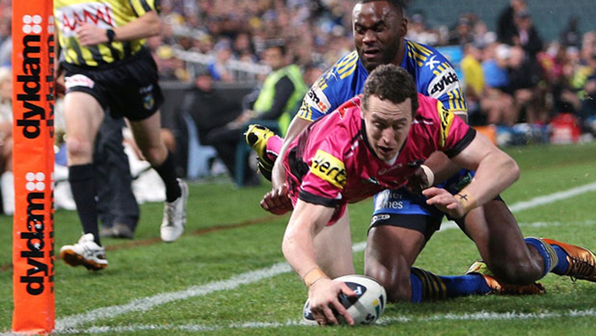 David Simmons crosses for one of two tries against Parramatta in Round 18; the in-form Penrith winger has added four four-pointers since then to become the leading tryscorer with 19 heading into the final three rounds of the 2013 Telstra Premiership.