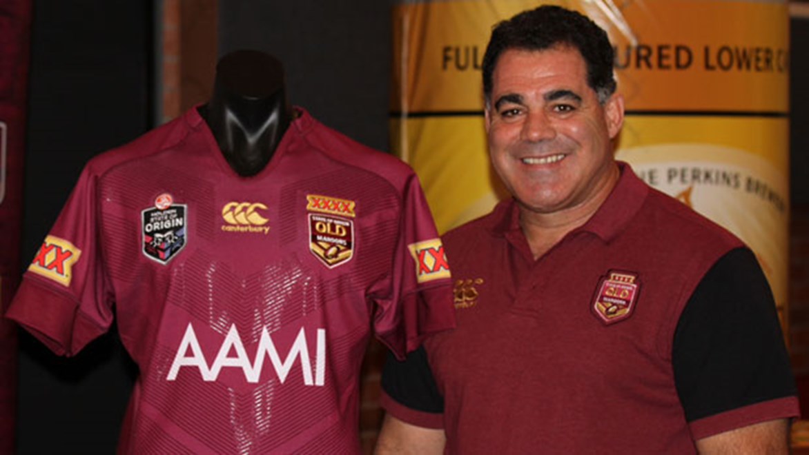 Maroons coach Mal Meninga poses with the new Queensland Origin jersey for 2014.