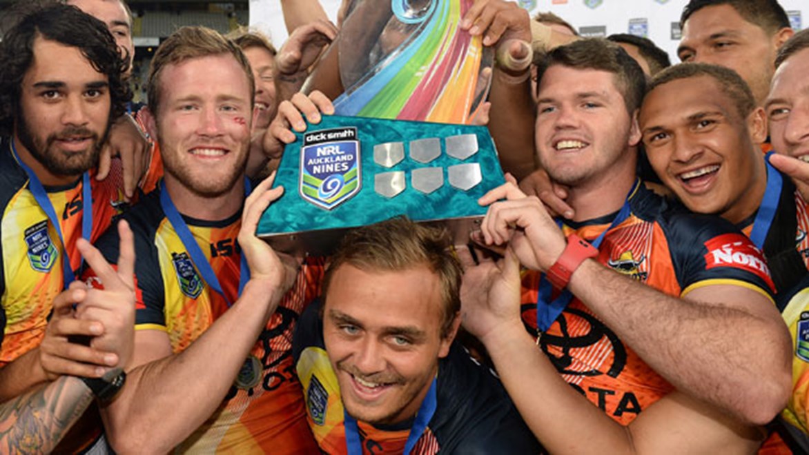 Anthony Mitchell (centre) celebrates with his North Queensland teammates, including injured roommate Lachlan Coote (right).