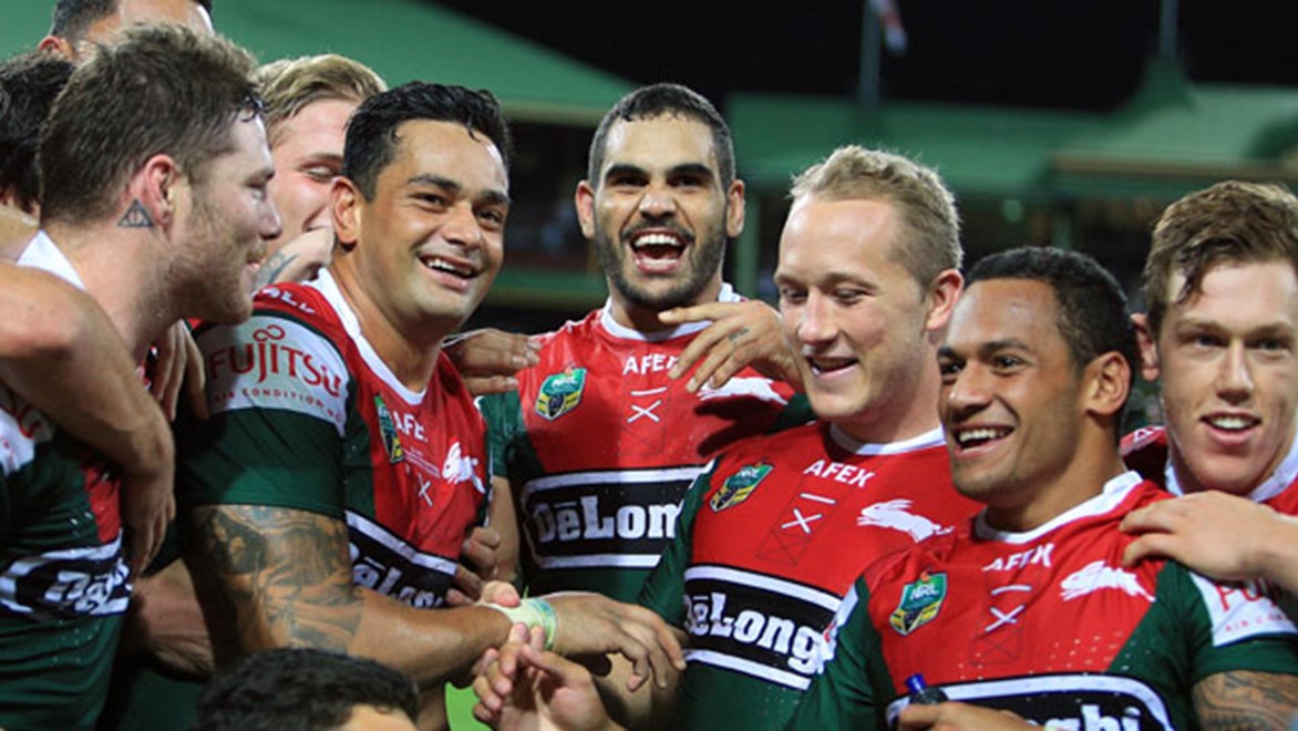 Teammates surround record-breaker John Sutton as the Rabbitohs celebrate their 20-point win over the Dragons at the SCG. Copyright: Robb Cox/NRL Photos