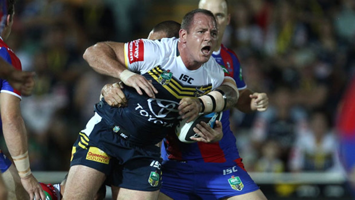 Cowboys prop Matt Scott takes a charge during his side's match against the Knights in Townsville. Copyright: Col Whelan/NRL Photos
