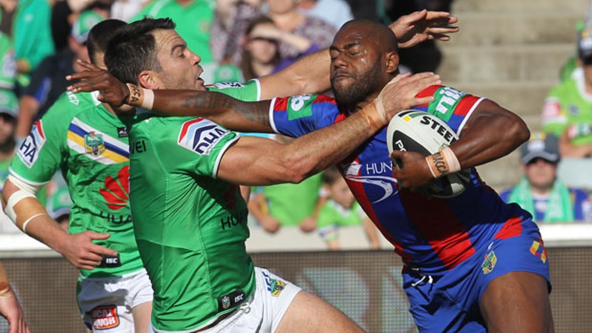 Knights winger Akuila Uate takes on Raiders prop David Shillington during their Saturday afternoon clash in Canberra. Copyright: Col Whelan/NRL Photos