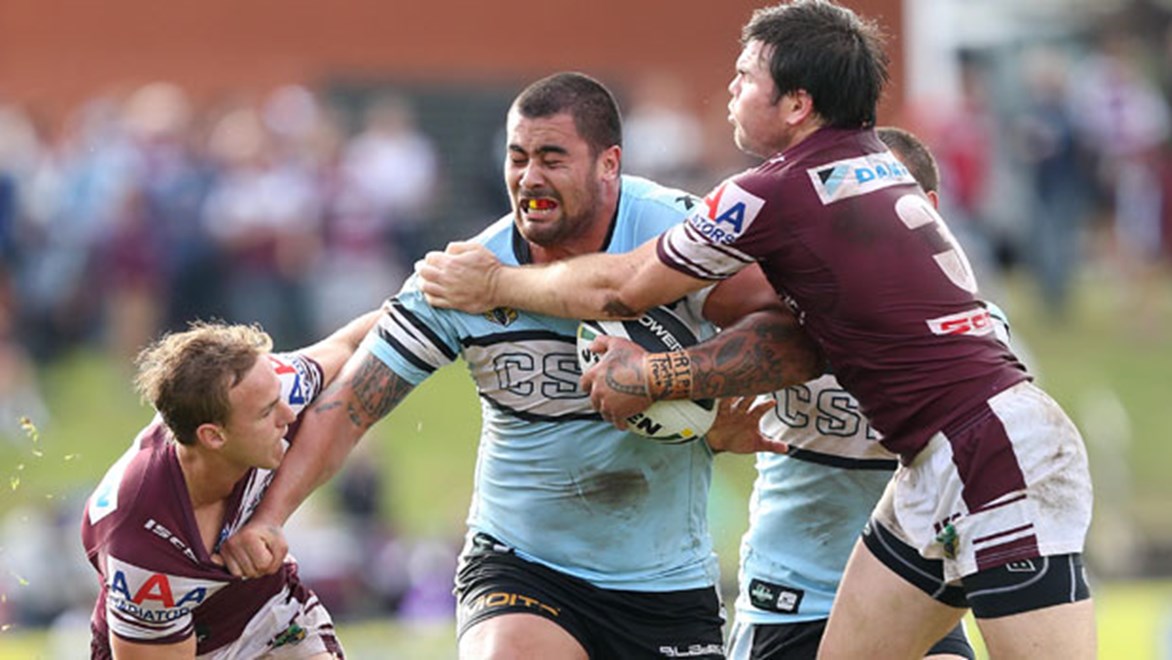 Sharks prop Andrew Fifita is swarmed by Manly's Daly Cherry-Evans (left) and Jamie Lyon (right) during their Sunday clash at Brookvale Oval. Copyright: Robb Cox/NRL Photos