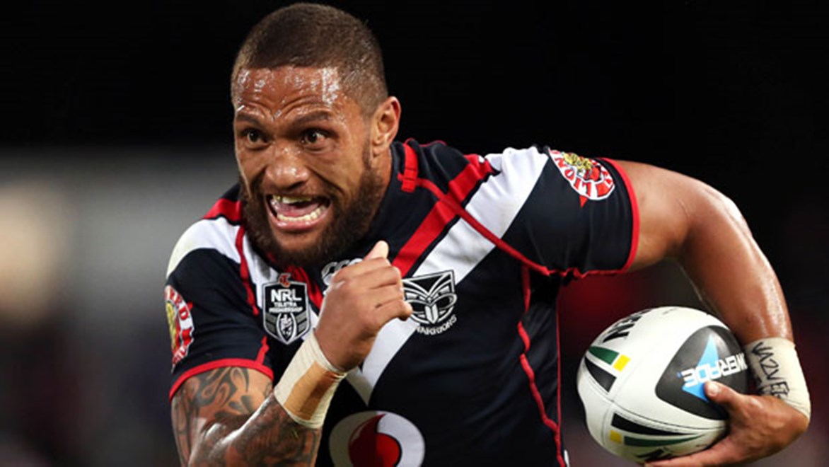Warriors try-scorer Manu Vatuvei takes a charge against the Dragons during their Saturday night clash at WIN Jubilee Stadium.