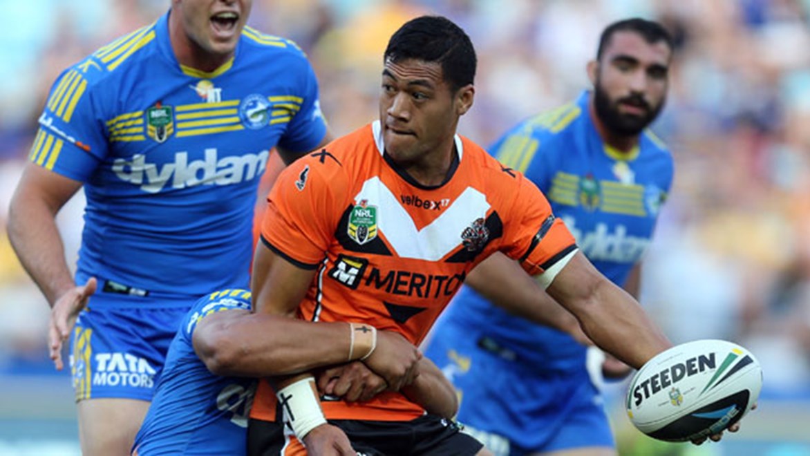 Wests Tigers centre Tim Simona looks for support in a thrilling Easter Monday clash with the Eels.