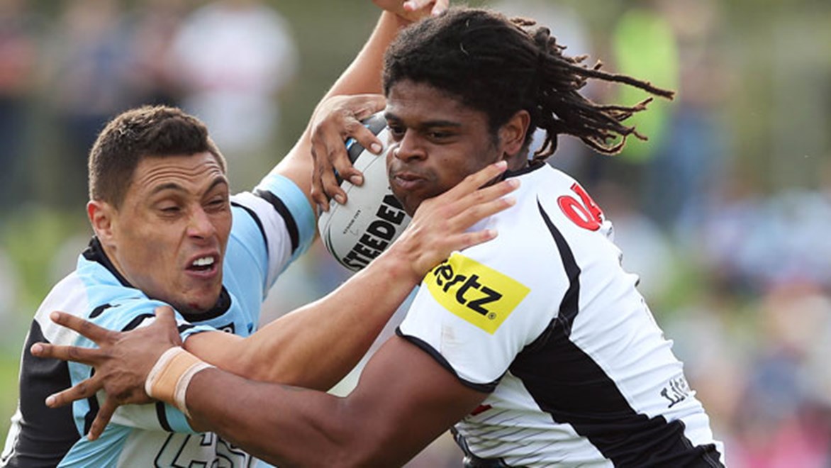 Panthers centre Jamal Idris tangles with Sharks forward Anthony Tupou during their Saturday clash at Remondis Stadium.