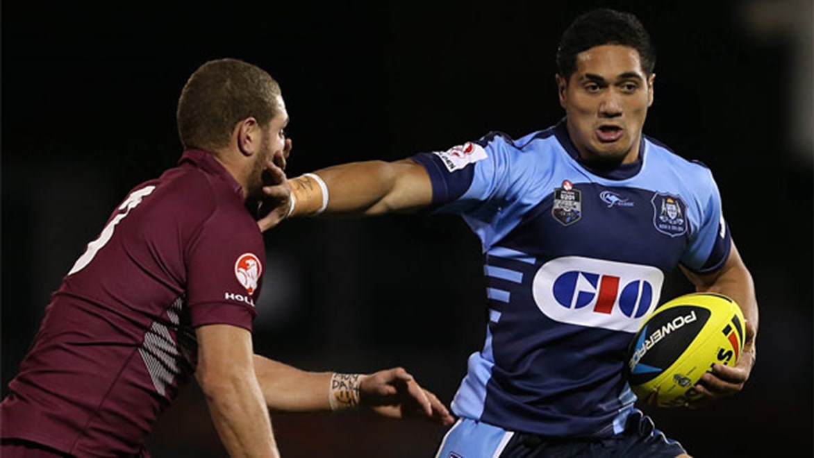 Sione Matautia holds off a Queensland defender during NSW's win in Saturday night's Under-20s State of Origin match.