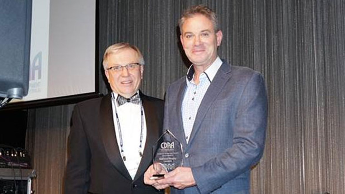 NRL Senior Education and Welfare Manager Paul Heptonstall, right, accepts the Career Development Association of Australia Excellence Award as Employer of the Year on behalf of the NRL.