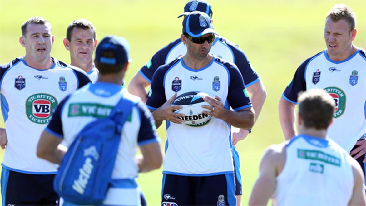 Blues coach Laurie Daley speaks to the team at its training base in Coffs Harbour.