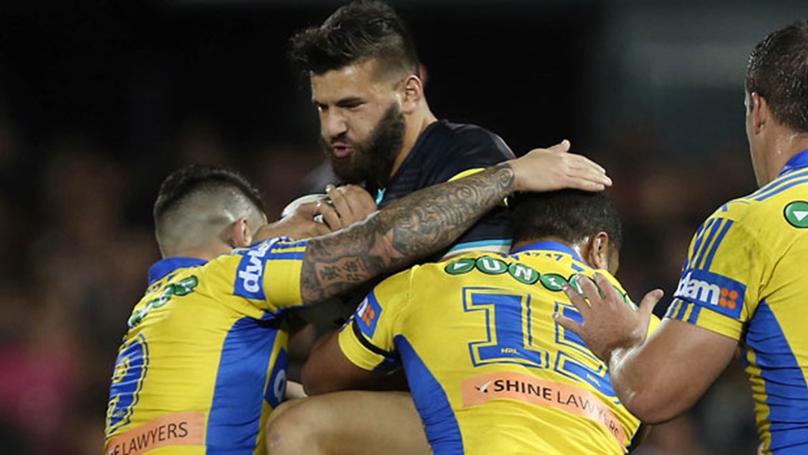 Panthers try-scorer Josh Mansour charges into the Parramatta defence during their Friday night clash.