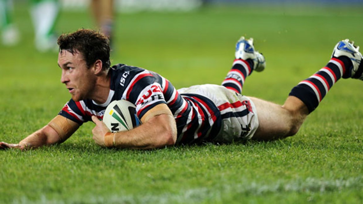 Roosters five-eighth James Maloney scores a try against the Raiders during a terrific performance on Saturday night.