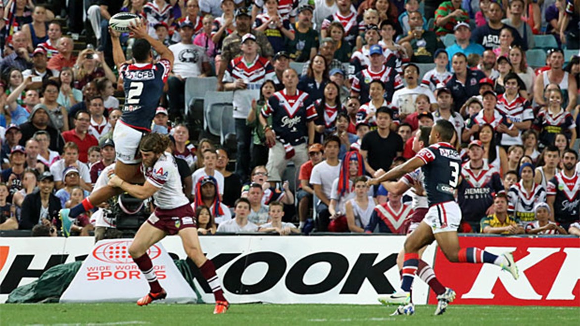Sydney's Daniel Tupou scores a leaping try over Manly's David Williams in the NRL Grand Final
