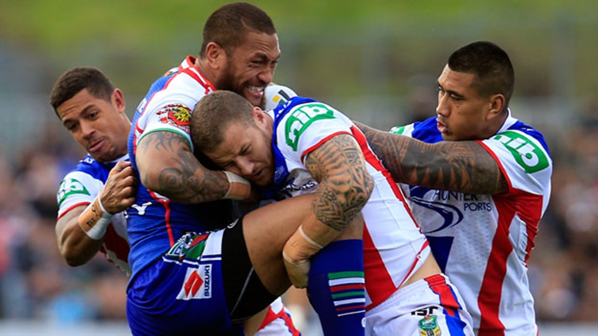 Warriors winger Manu Vatuvei charges into the Knights defence during their clash at Mt Smart Stadium on Sunday.