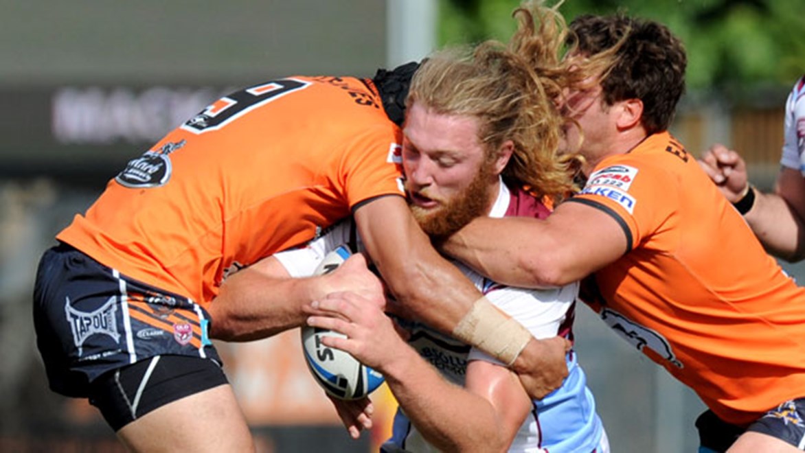 Mackay's Karl Davies attracts plenty of attention from the Easts Tigers defence in Round 14 of the Intrust Super Cup.