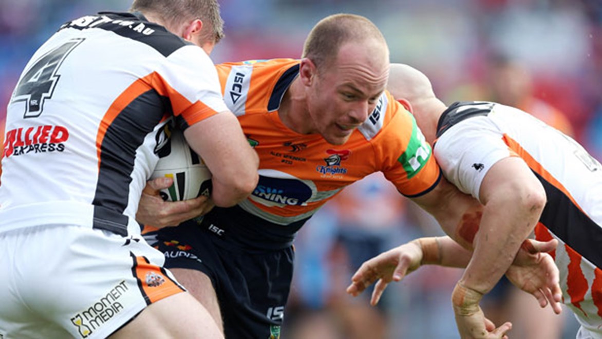 Knights forward Beau Scott takes a hit-up in his side's Sunday clash against Wests Tigers.
