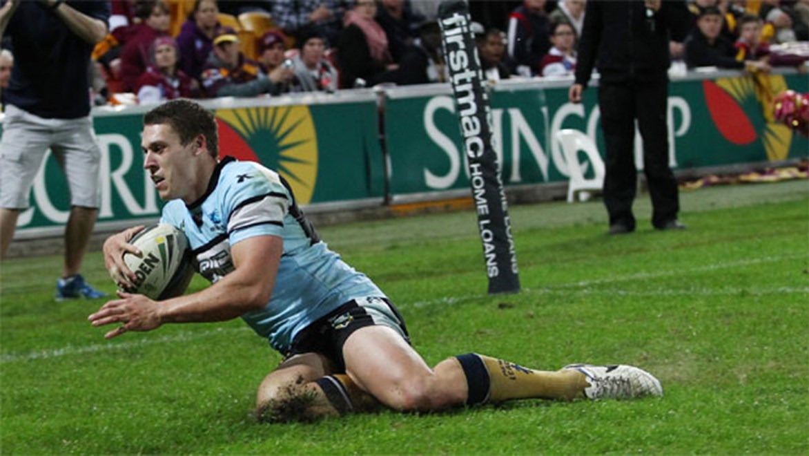 Drought-breaker... Sharks winger Jacob Gagan posts Cronulla's first points in 324 minutes of football.