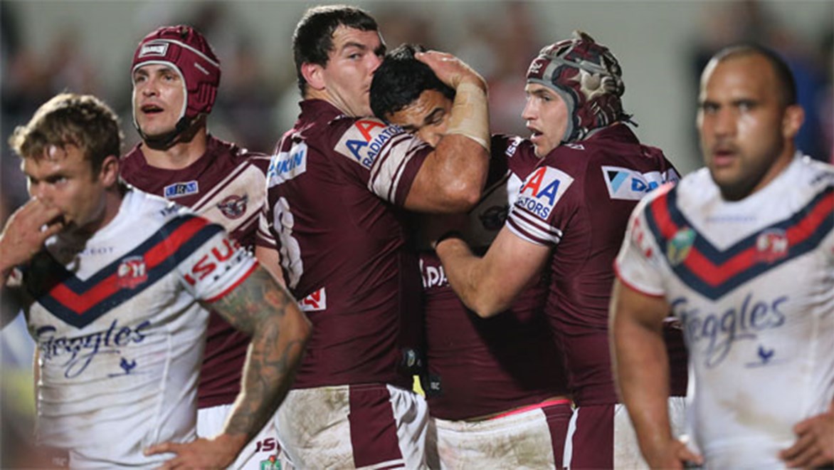 Manly players celebrate a try to winger Peta Hiku in the Round 16 win over the Roosters at Brookvale.