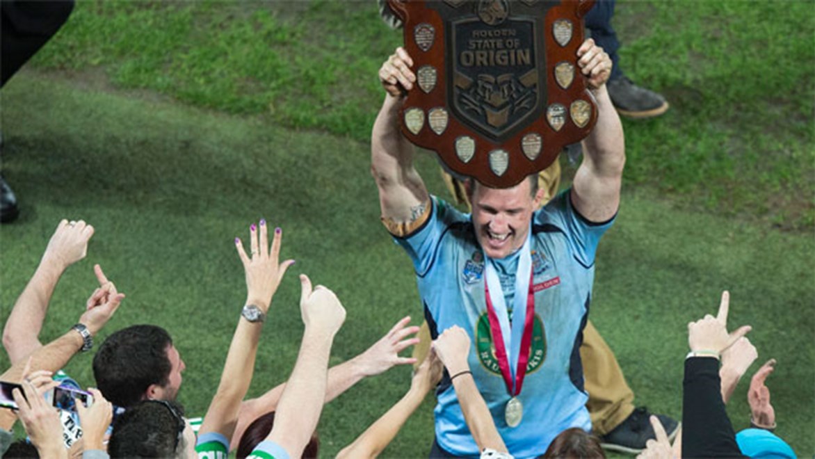 NSW Blues captain Paul Gallen lifts the State of Origin trophy.
