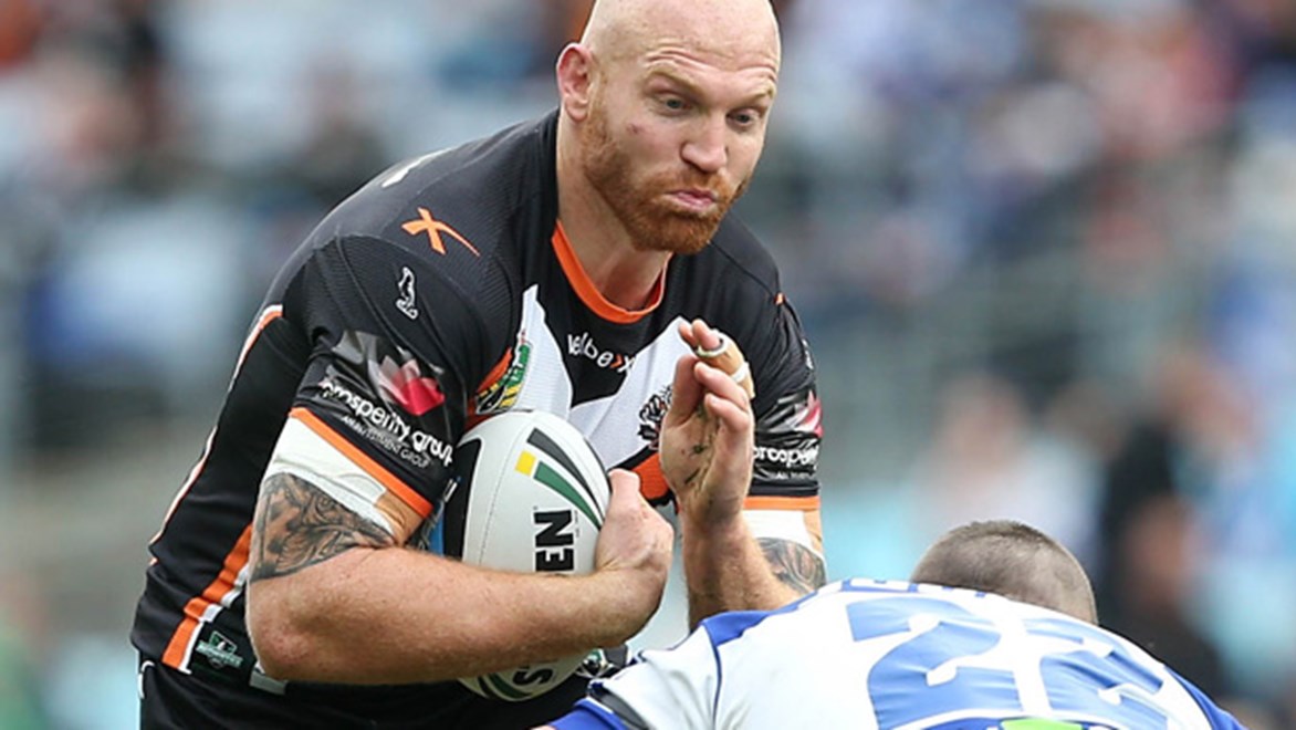Keith Galloway charges forward during the Tigers' Round 19 clash with the Bulldogs at ANZ Stadium.