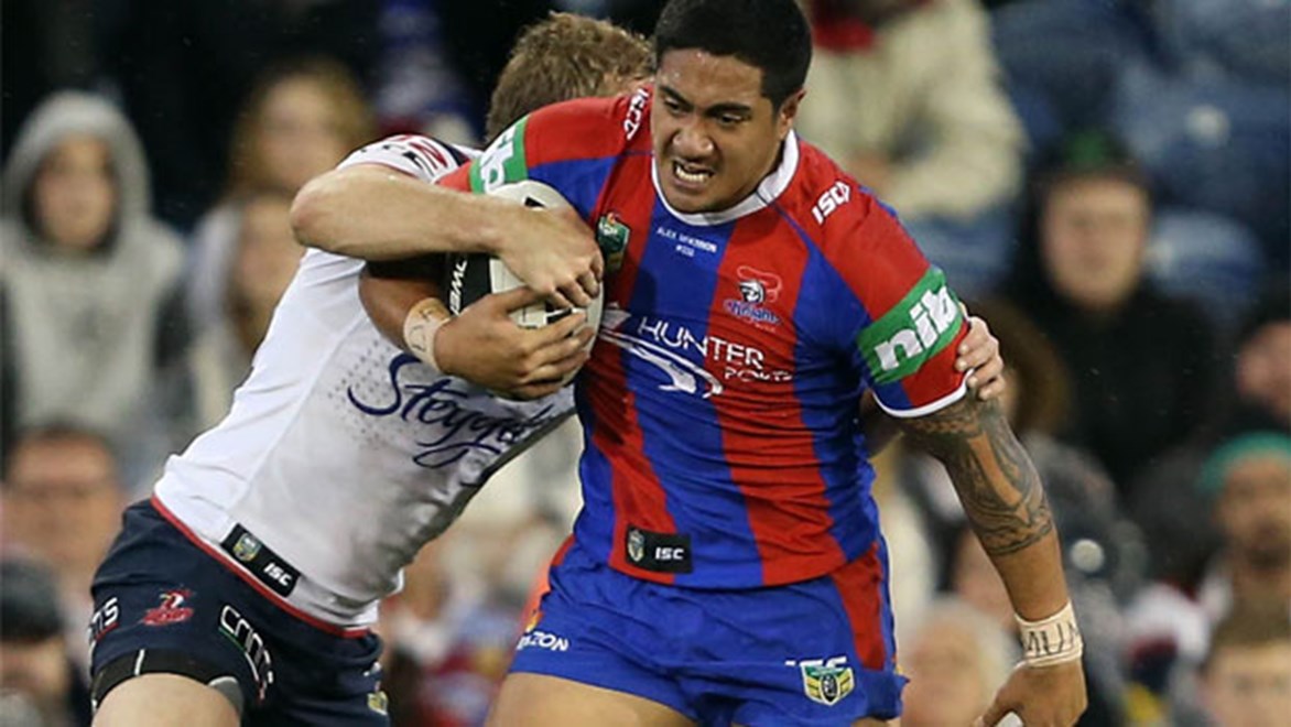 Knights debutant Chanel Mata'utia takes on the Roosters defence on Friday night.