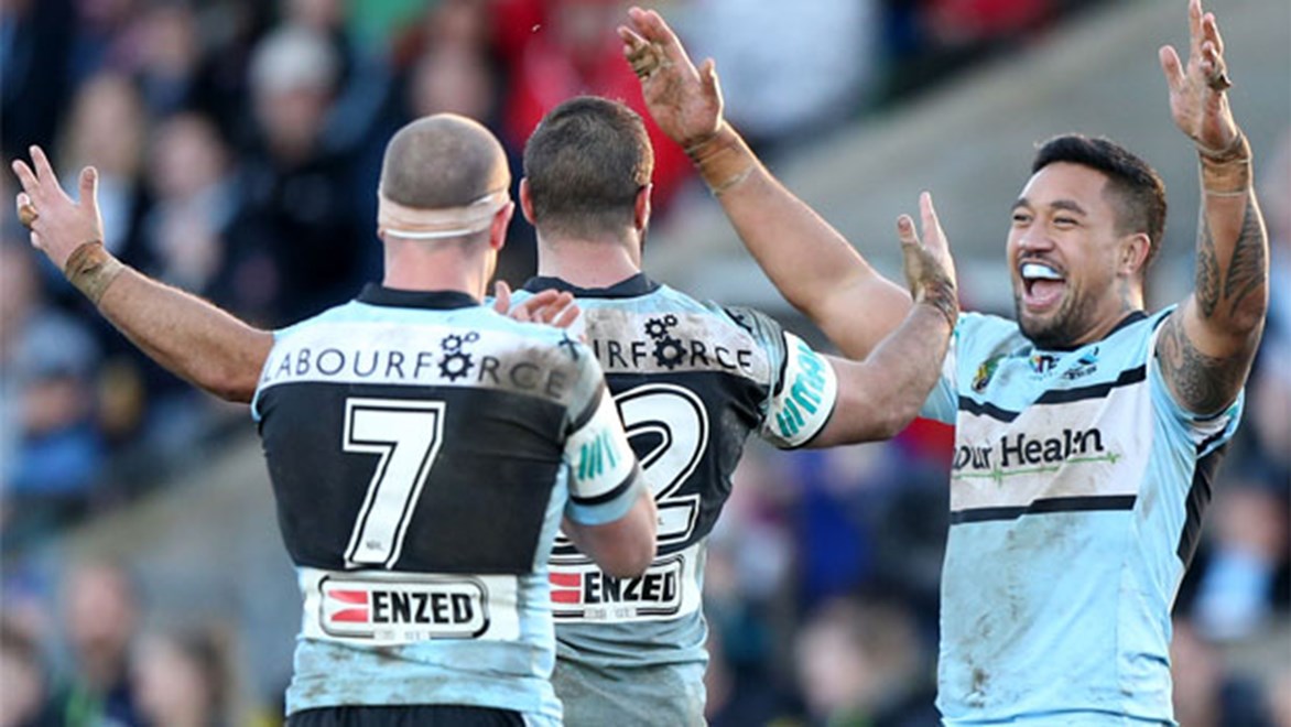 Tinirau Arona, Wade Graham and Jeff Robson celebrate Cronulla's 18-16 win over Penrith in Bathurst in Round 20.