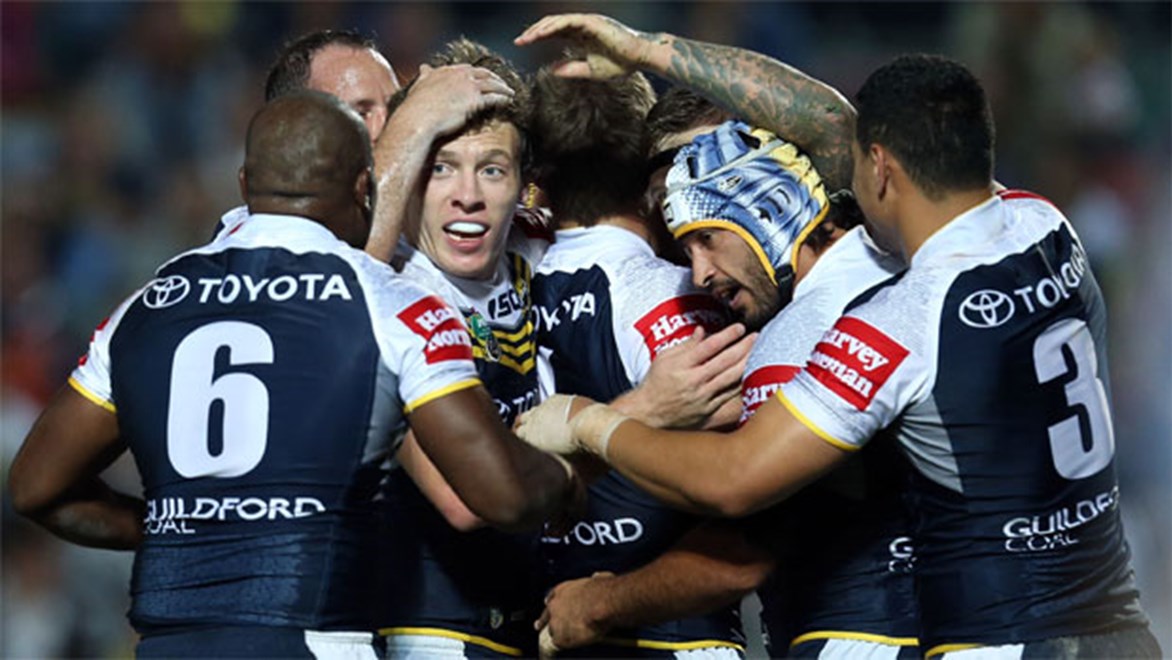 The Cowboys celebrate one of their 12 tries in a massive 64-6 win over Wests Tigers in Townsville in Round 22.