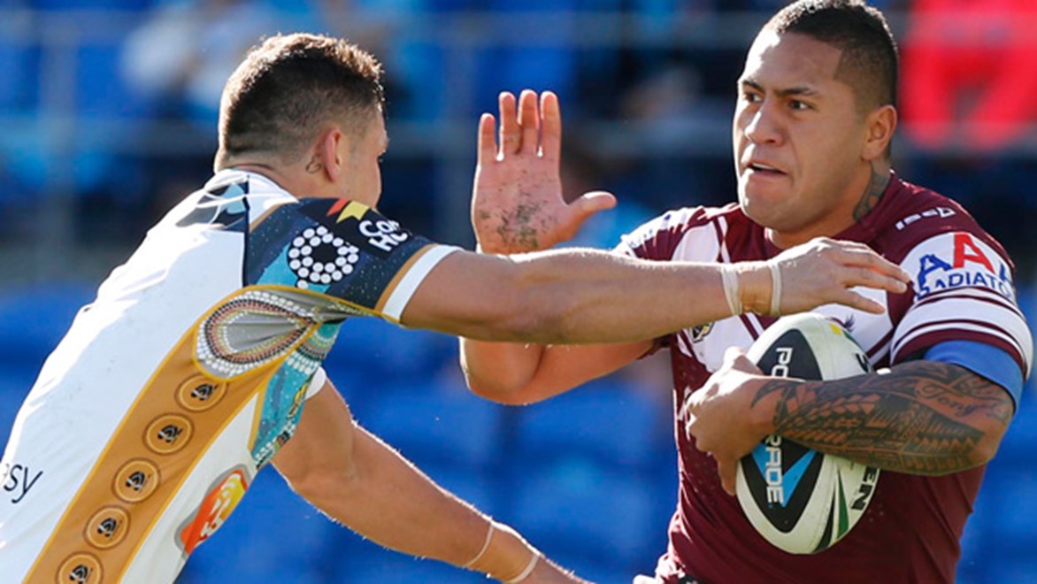 Jorge Taufua breaks a tackle in the Sea Eagles' Round 23 clash with the Titans at Cbus Super Stadium.