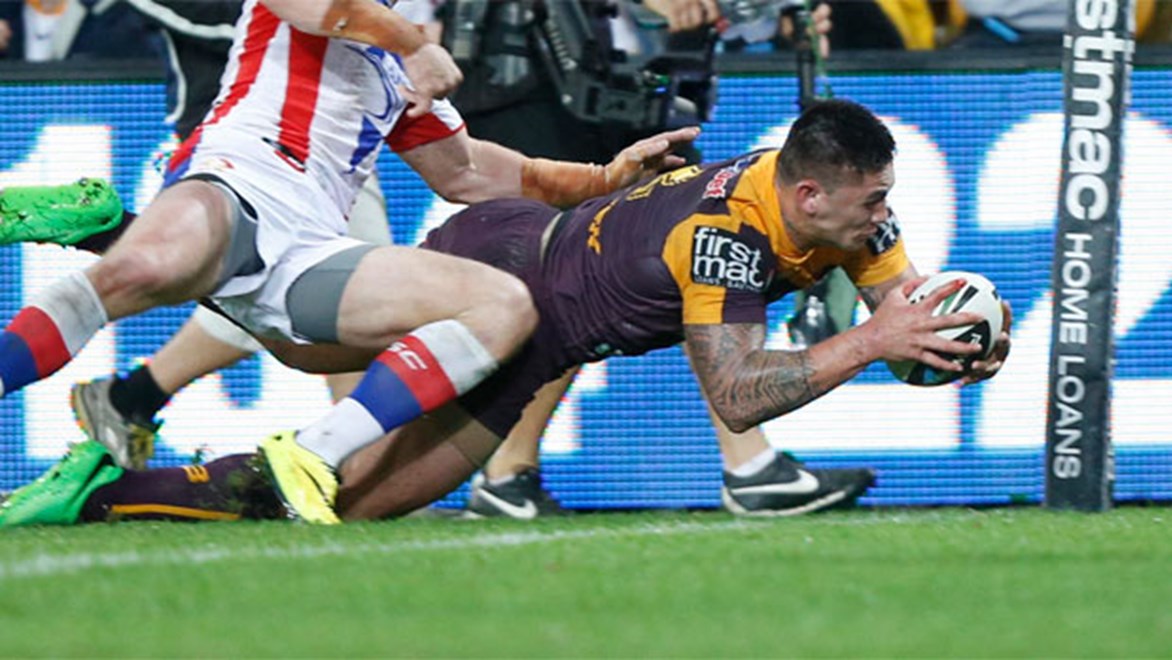 Daniel Vidot dives over in the corner to score for Brisbane against Newcastle on Saturday.