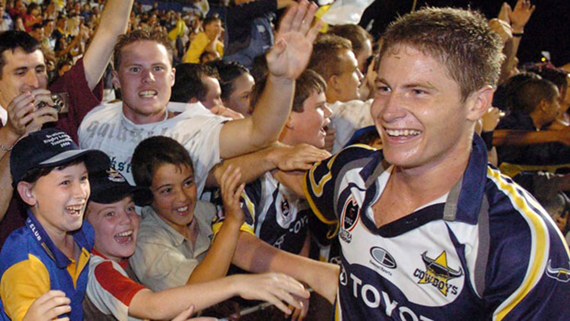 Lone try-scorer in the 2004 Elimination Final David Myles celebrates with Cowboys fans after defeating the Broncos 10-0 in 2004.