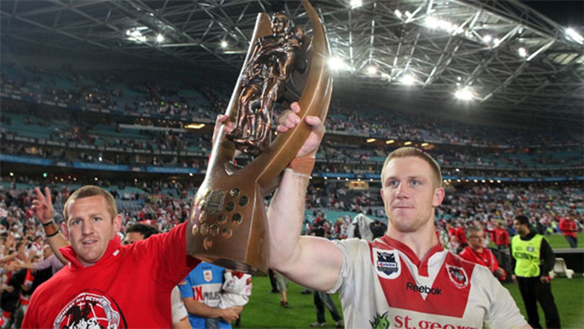 Ben Creagh (right) raises the Provan Summons trophy after winning the 2010 NRL Grand Final with the Dragons.