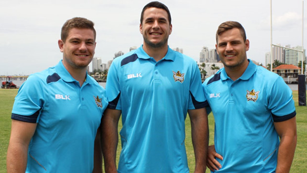 Former Bulldogs teammates Paul Carter, Lachlan Burr and Aidan Sezer have all moved to the Titans in search of more NRL game time, with Burr in his first week with the club.