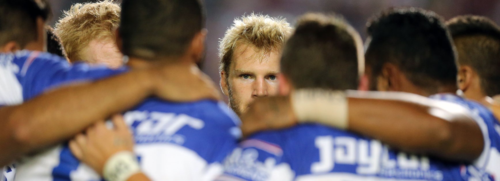 Aiden Tolman stands in the Bulldogs' huddle prior to their Round 3 meeting with the Sea Eagles.