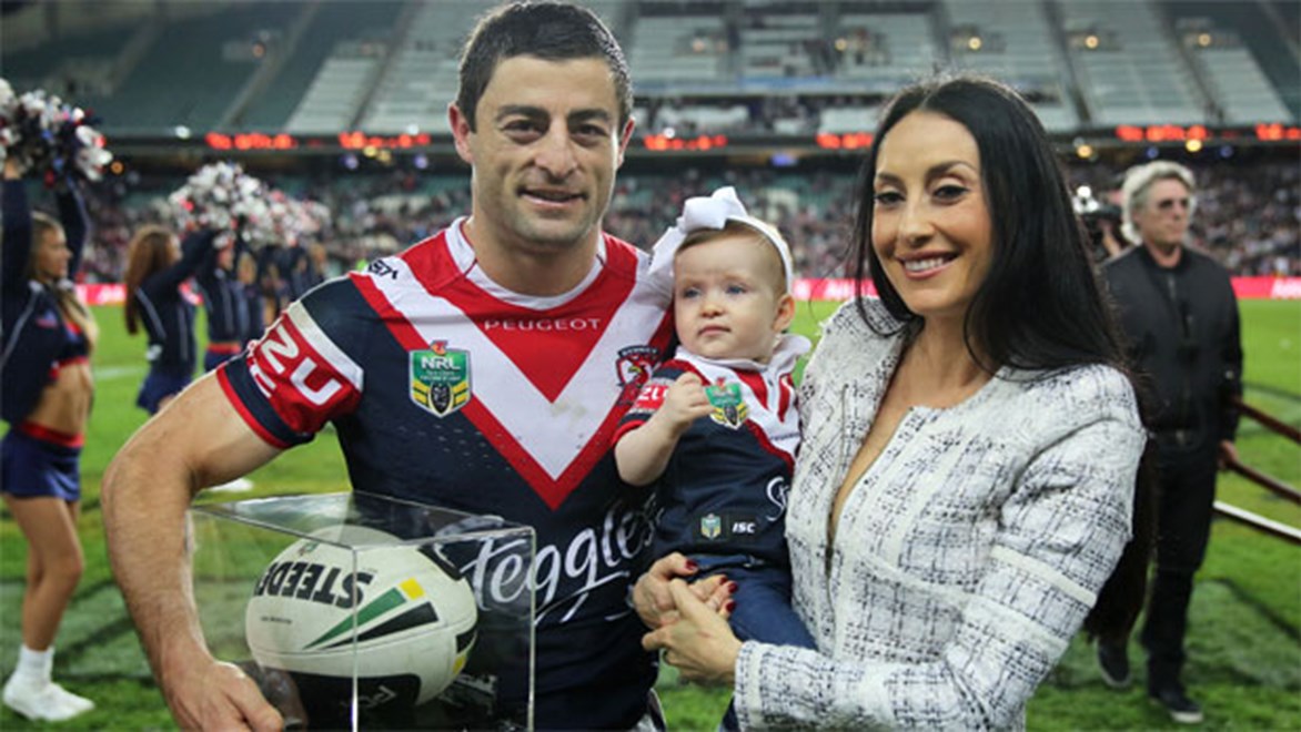 Anthony Minichiello with his family at the end of his farewell game last season.