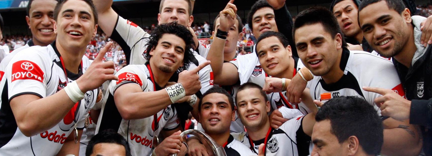 Mark Ioane and Matt Robinson (centre with trophy) and their Warriors teammates celebrate their NYC win in 2010.