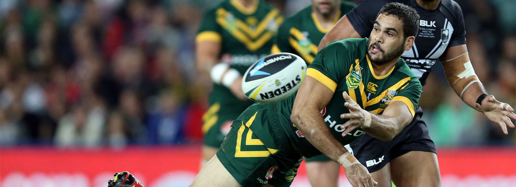 Kangaroos star Greg Inglis gets an offload away during 2014's May Test match against New Zealand.