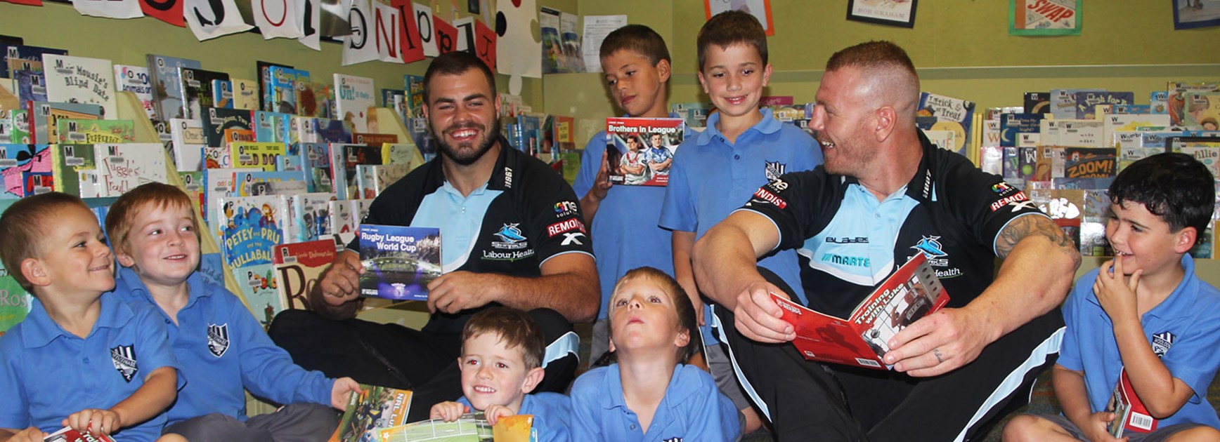 Sharks stars Wade Graham and Luke Lewis launch the Rugby League Reads program at Cronulla Library.