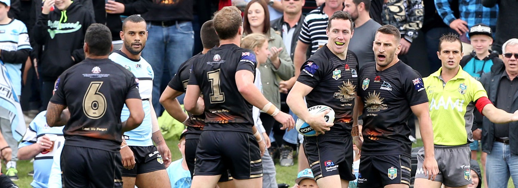 Penrith players celebrate during their Round 8 win over the Sharks at Pepper Stadium.