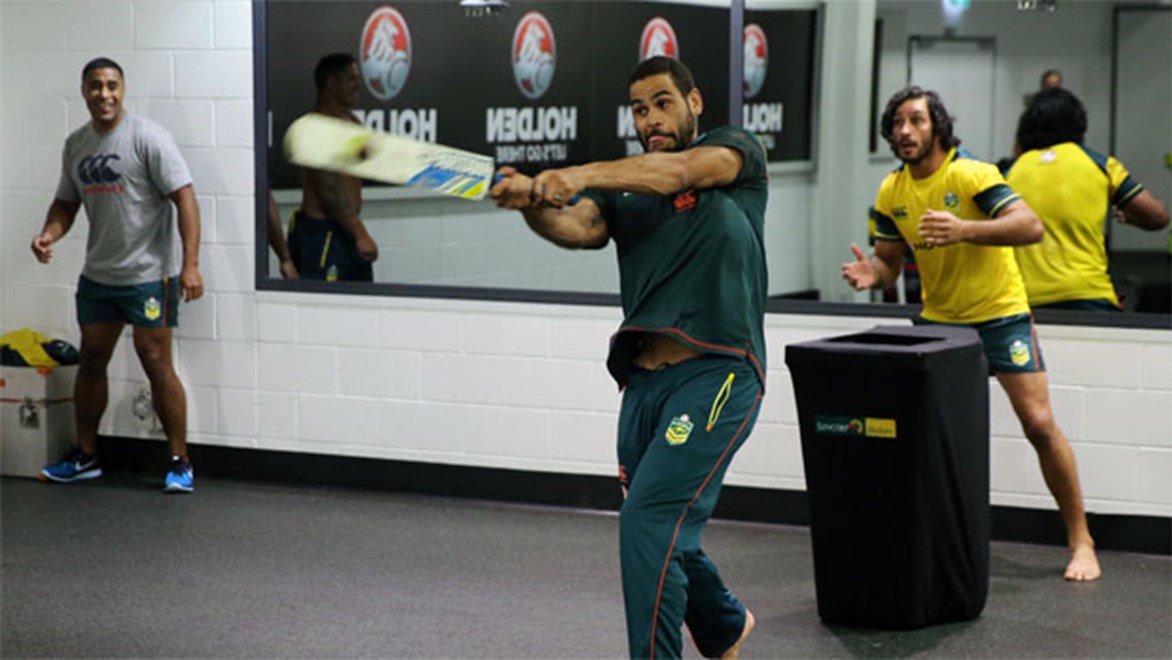 Greg Inglis wields the bat during the Kangaroos' impromptu cricket match in the sheds after Friday's Test match was postponed due to rain.