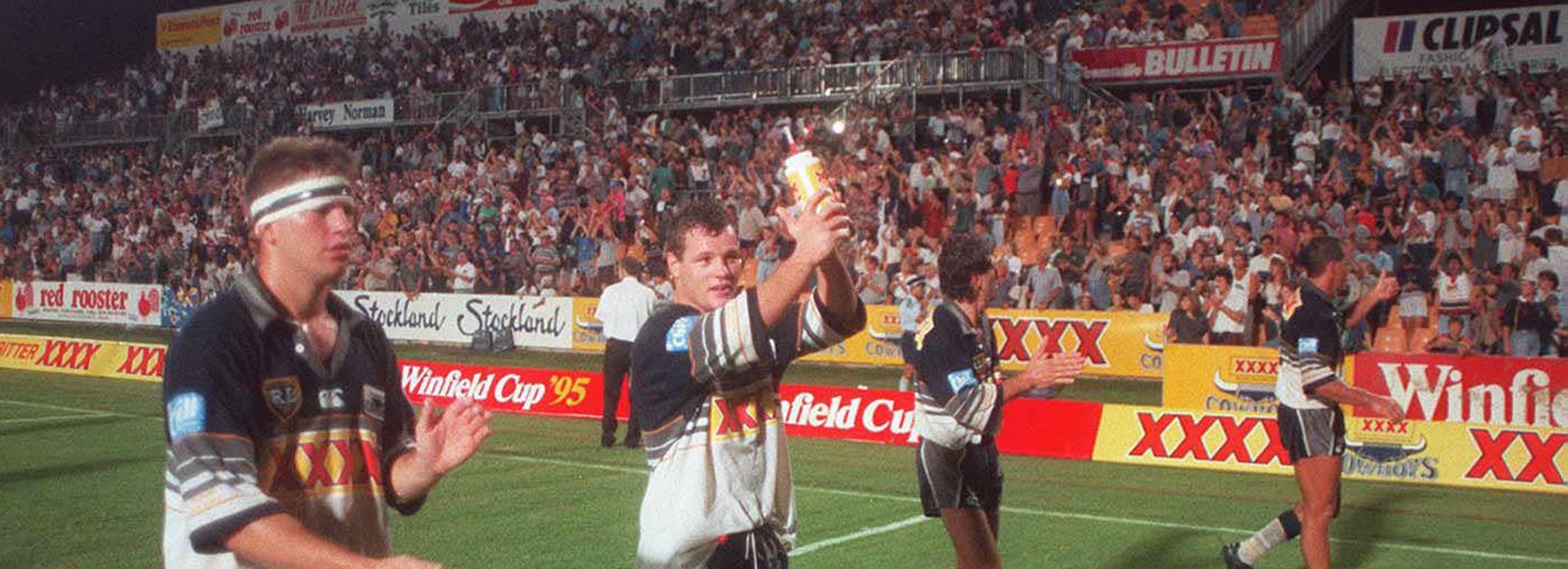Cowboys players thank the crowd after their first premiership game in 1995.
