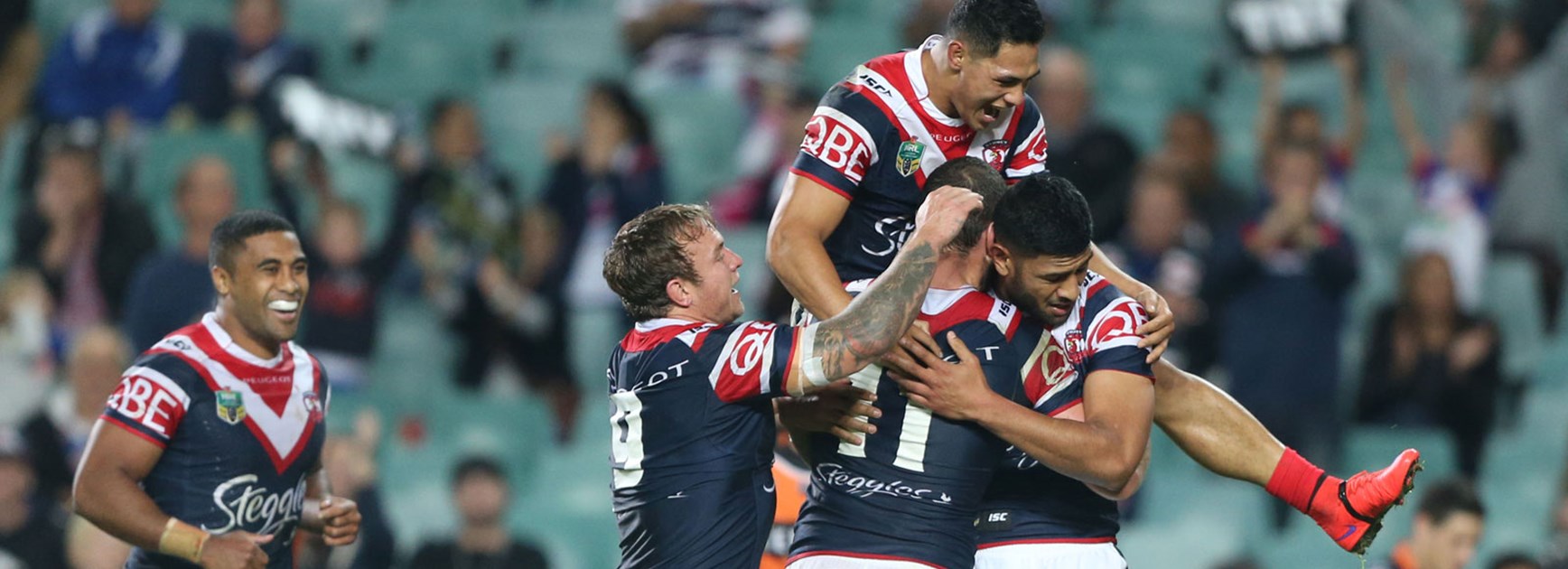 Roosters players celebrate during their Round 9 win over Wests Tigers.