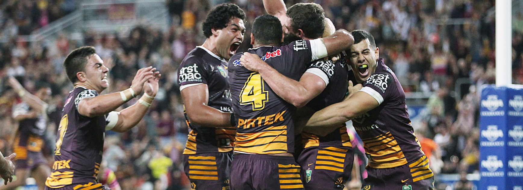 Broncos players celebrate Corey Oates' match-winner against the Panthers in Round 9.