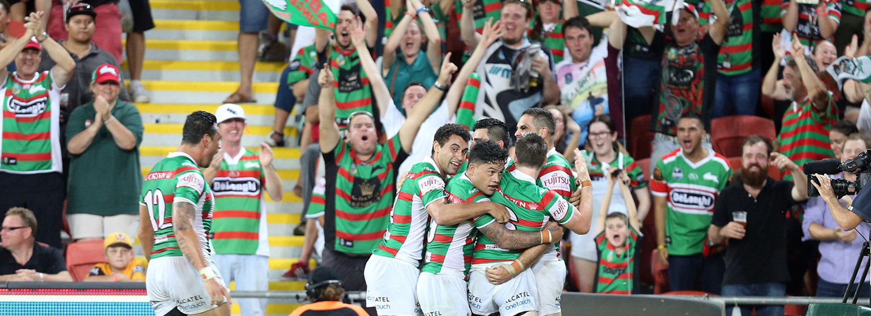 South Sydney players and fans celebrate during their Round 1 clash with the Broncos.